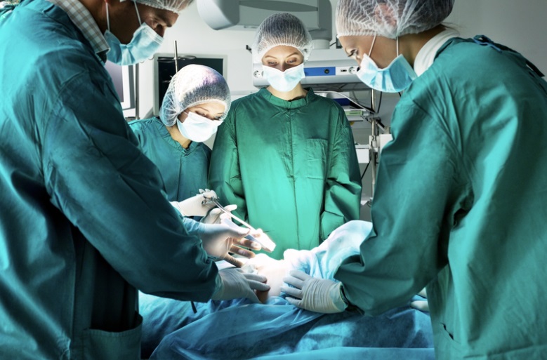 Surgical team operating on a patient.